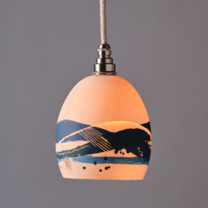 A lit pendant ceramic lampshade by artist Amy Frankie Smith.